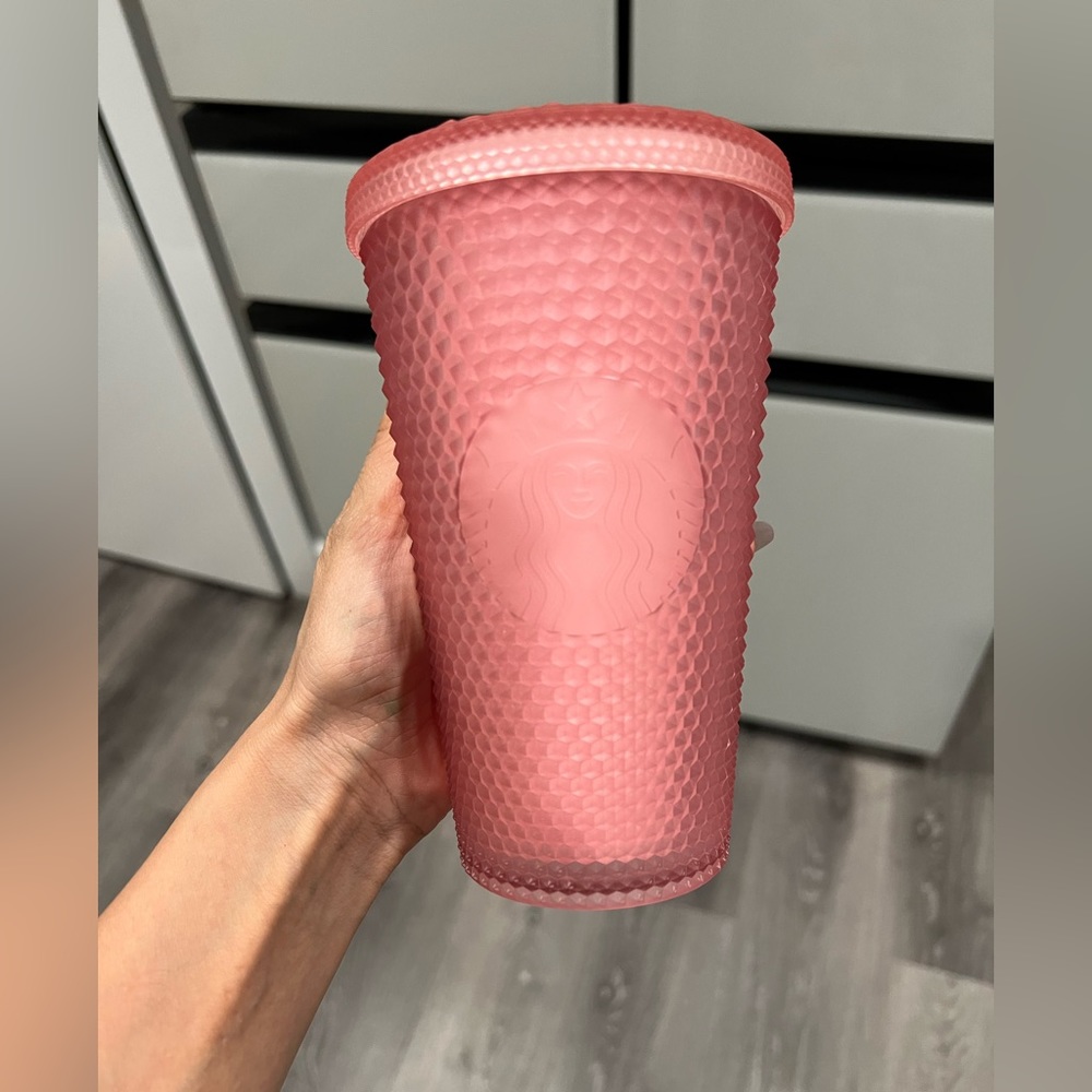 Starbucks grande size pink studded tumbler. No straw
